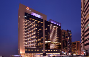 Nighttime view of Marriott Downtown Abu Dhabi, showcasing its illuminated modern architecture and urban surroundings. 