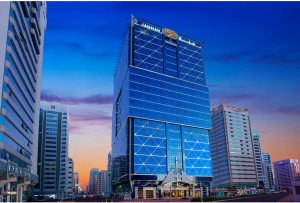 Nighttime view of Jannah Hotels & Resorts, featuring a tall structure set against a clear night sky. 